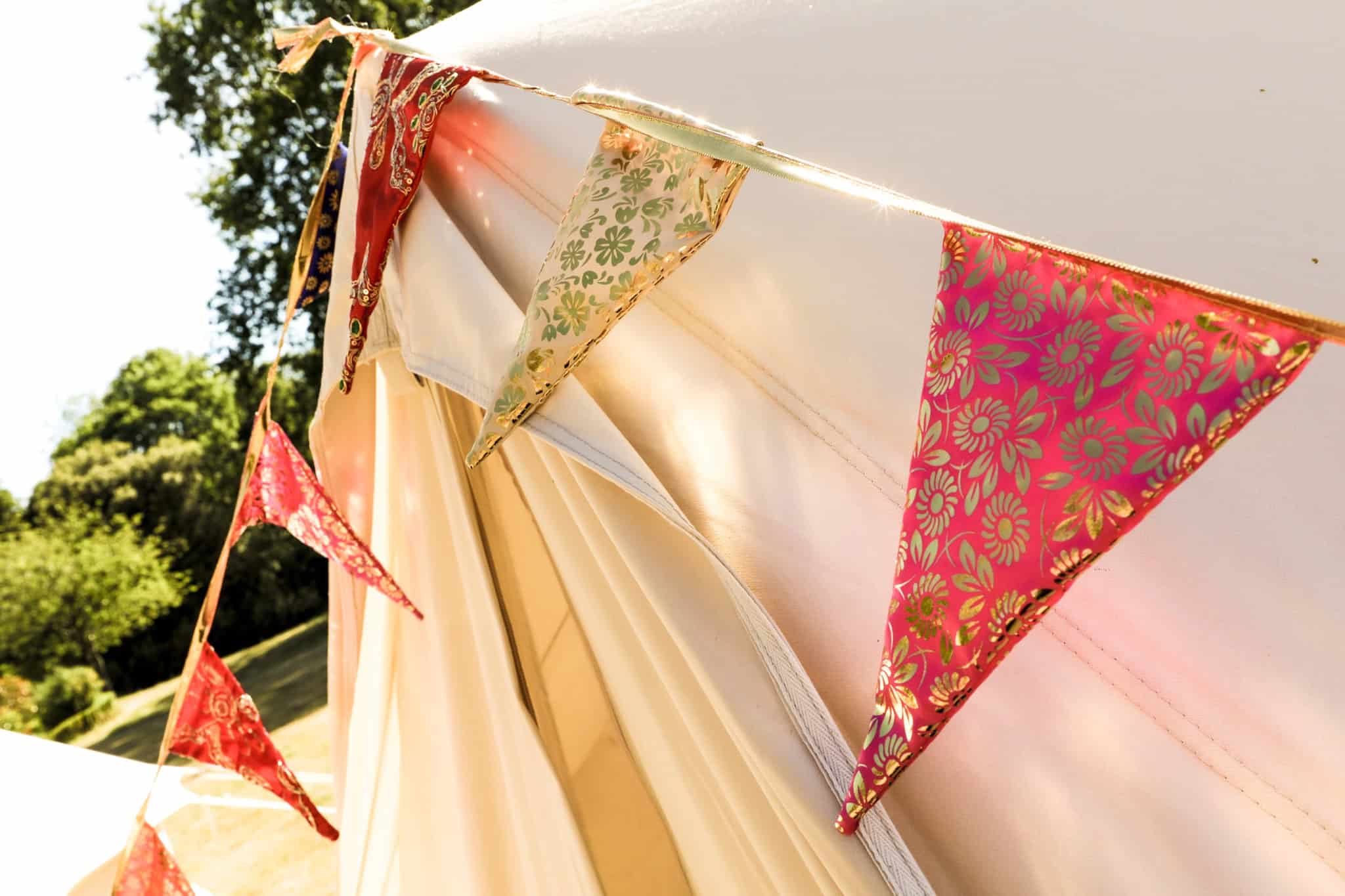 beautiful-gold-and-red-bunting-on-bell-tent